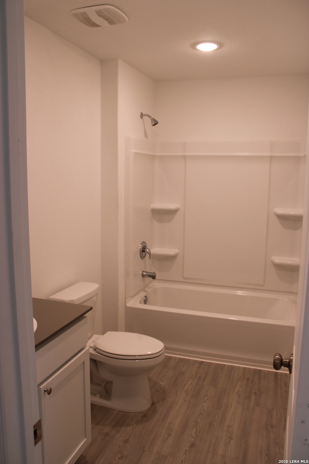 124 Horseshoe Trail Pleasanton, TX 78064 - Photo 12 of 16 a bathroom with a toilet a sink and a shower