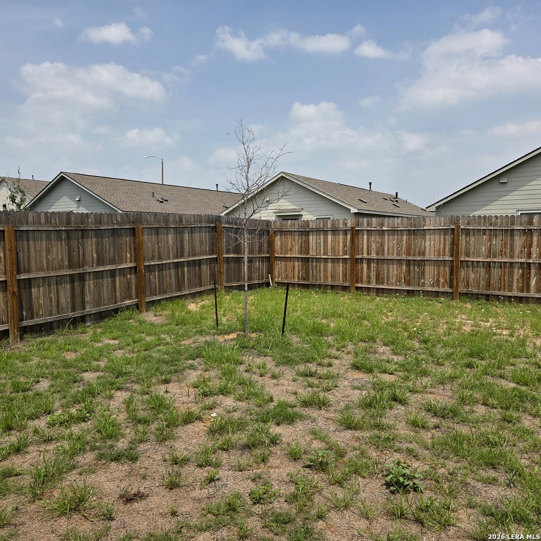 124 Horseshoe Trail Pleasanton, TX 78064 - Photo 15 of 16 a view of a yard in front of a house with a yard
