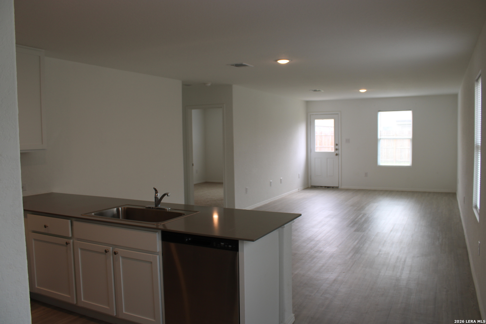 124 Horseshoe Trail Pleasanton, TX 78064 - Photo 3 of 16 a kitchen with sink and cabinets