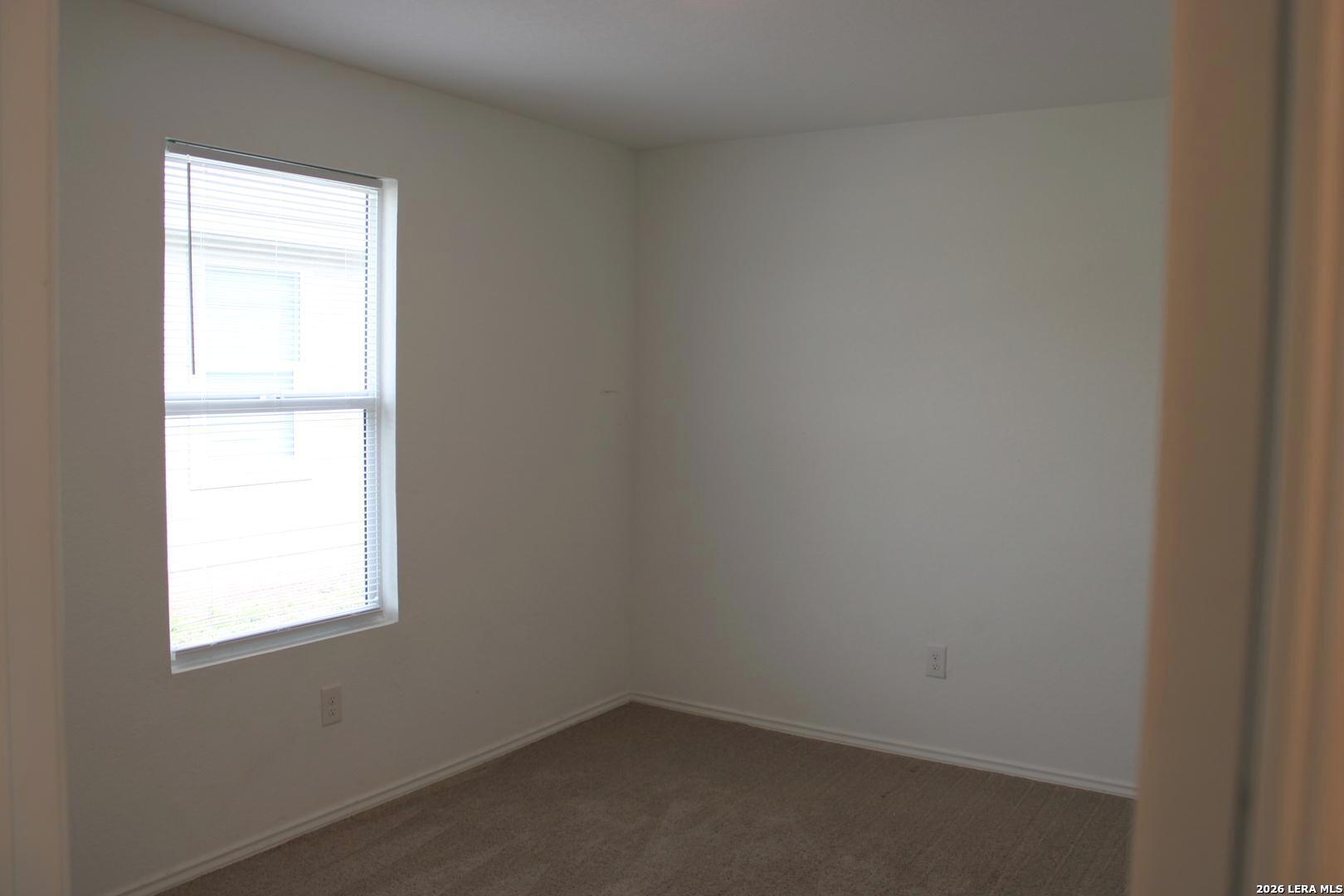 124 Horseshoe Trail Pleasanton, TX 78064 - Photo 9 of 16 a small space with a window