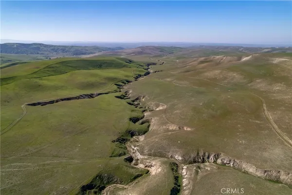 a view of residential houses with outdoor space