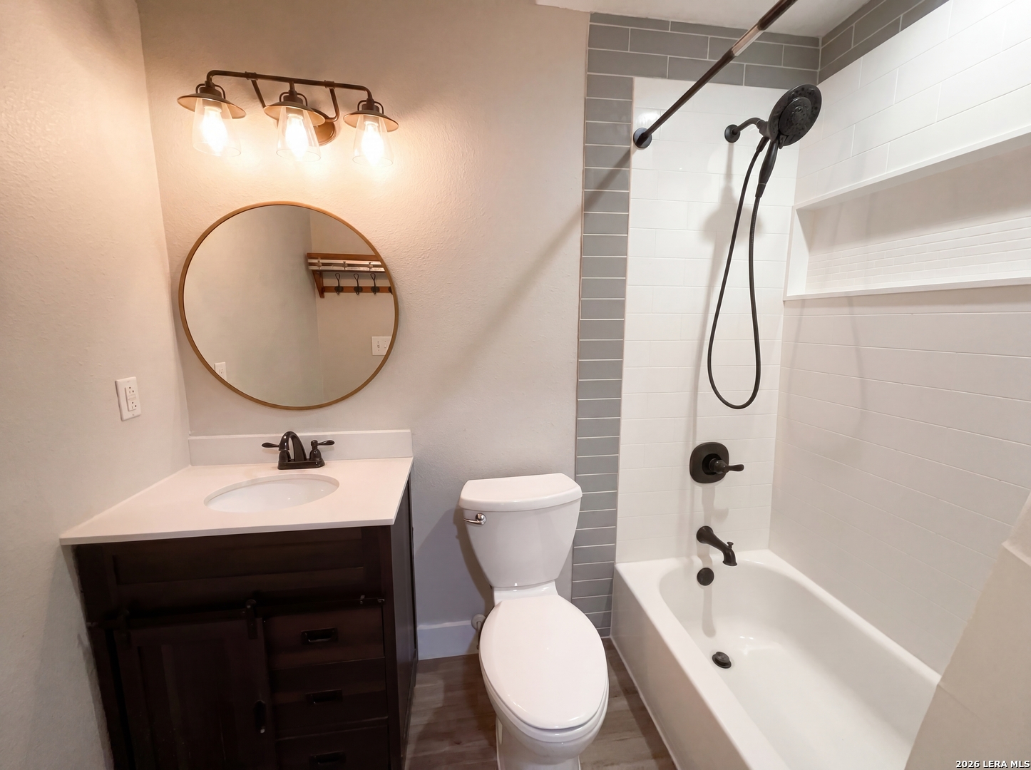15422 Geronimo Loop San Antonio, TX 78254 - Photo 17 of 21 a bathroom with a sink toilet and shower