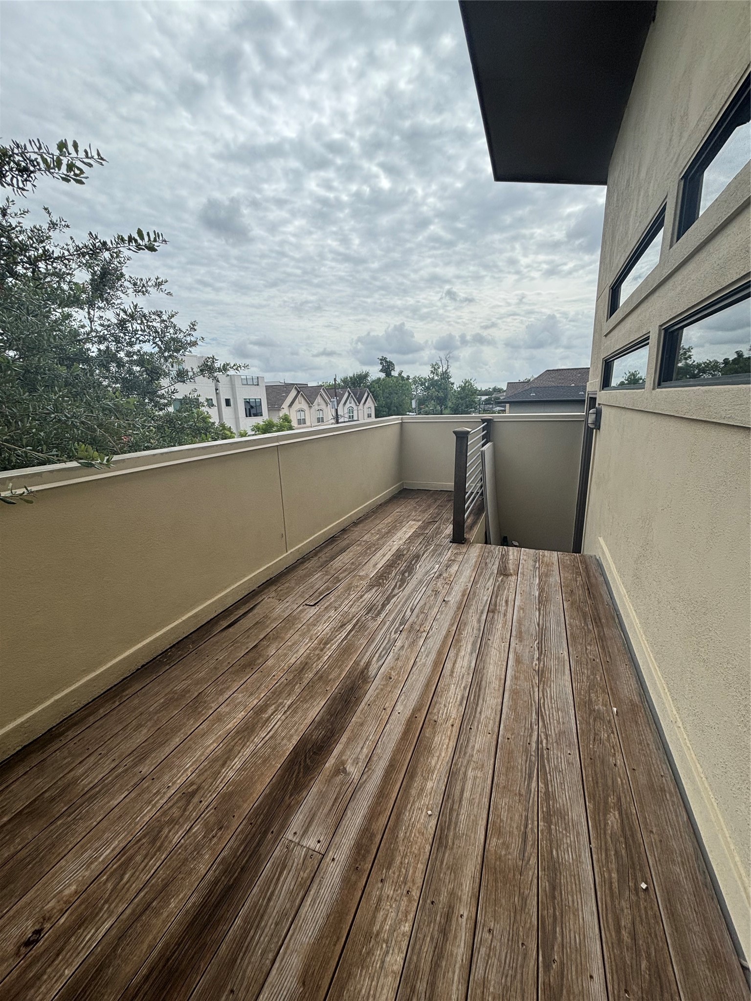 6016 Truro Street Houston, TX 77007 - Photo 14 of 26 Private third-floor balcony accessed from the game room, offering a peaceful outdoor retreat with neighborehood views.