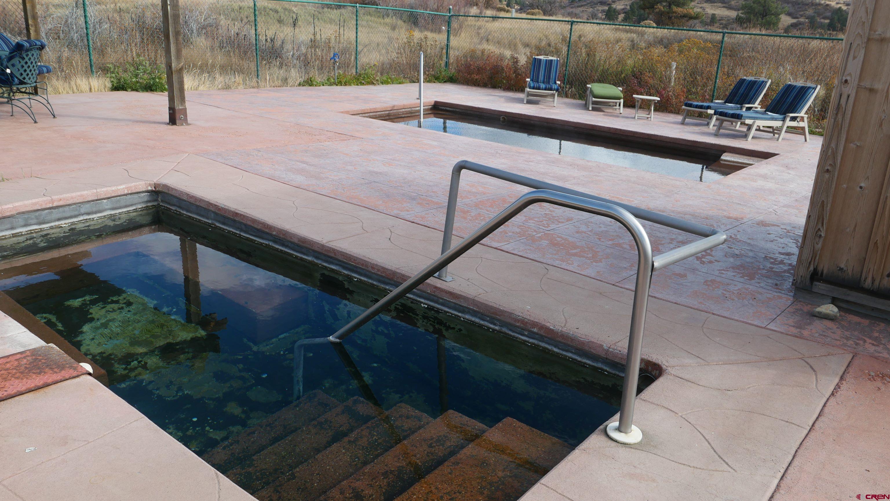673 Spring Creek Circle Chromo, CO 81128 - Photo 12 of 13 a view of a backyard with sitting area