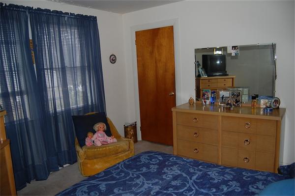 63 Bayview Road Marblehead, MA 01945 - Photo 5 of 10 a bedroom with a bed and wooden floor