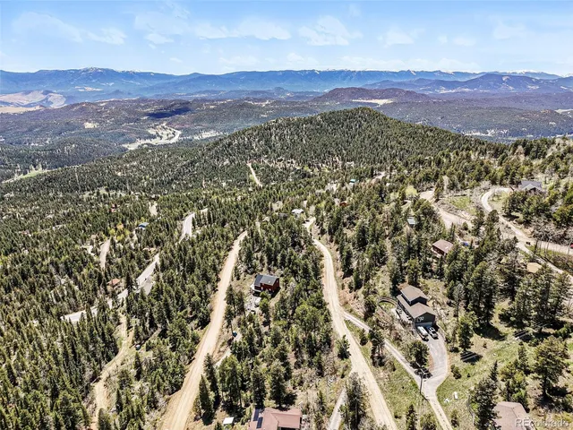 a view of a city with mountains in the background