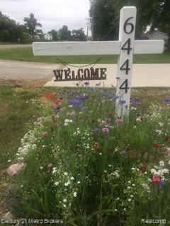 6444 Elms Road Swartz Creek, MI 48473 - Photo 2 of 47 6444 elms address flowers.JPG