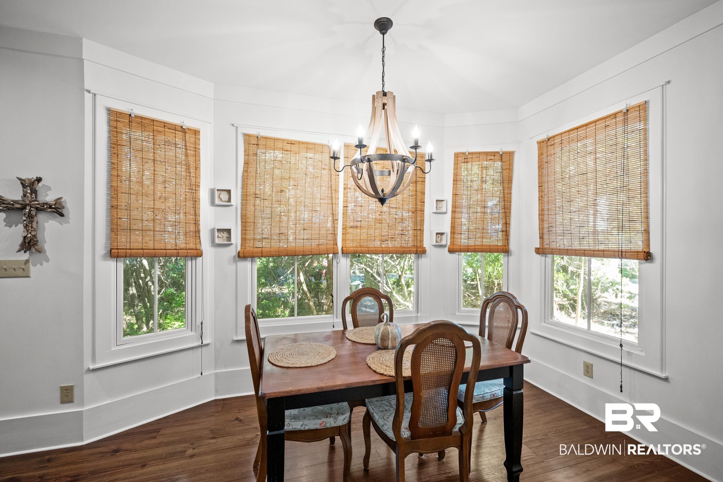 25773 Canal Road, Unit 28 Orange Beach, AL 36561 - Photo 10 of 48 Dining space featuring dark wood-type flooring and a chandelier