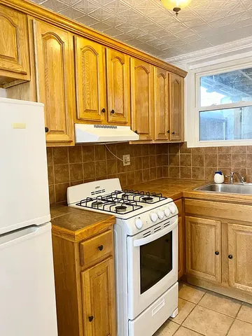 a kitchen with a stove top oven