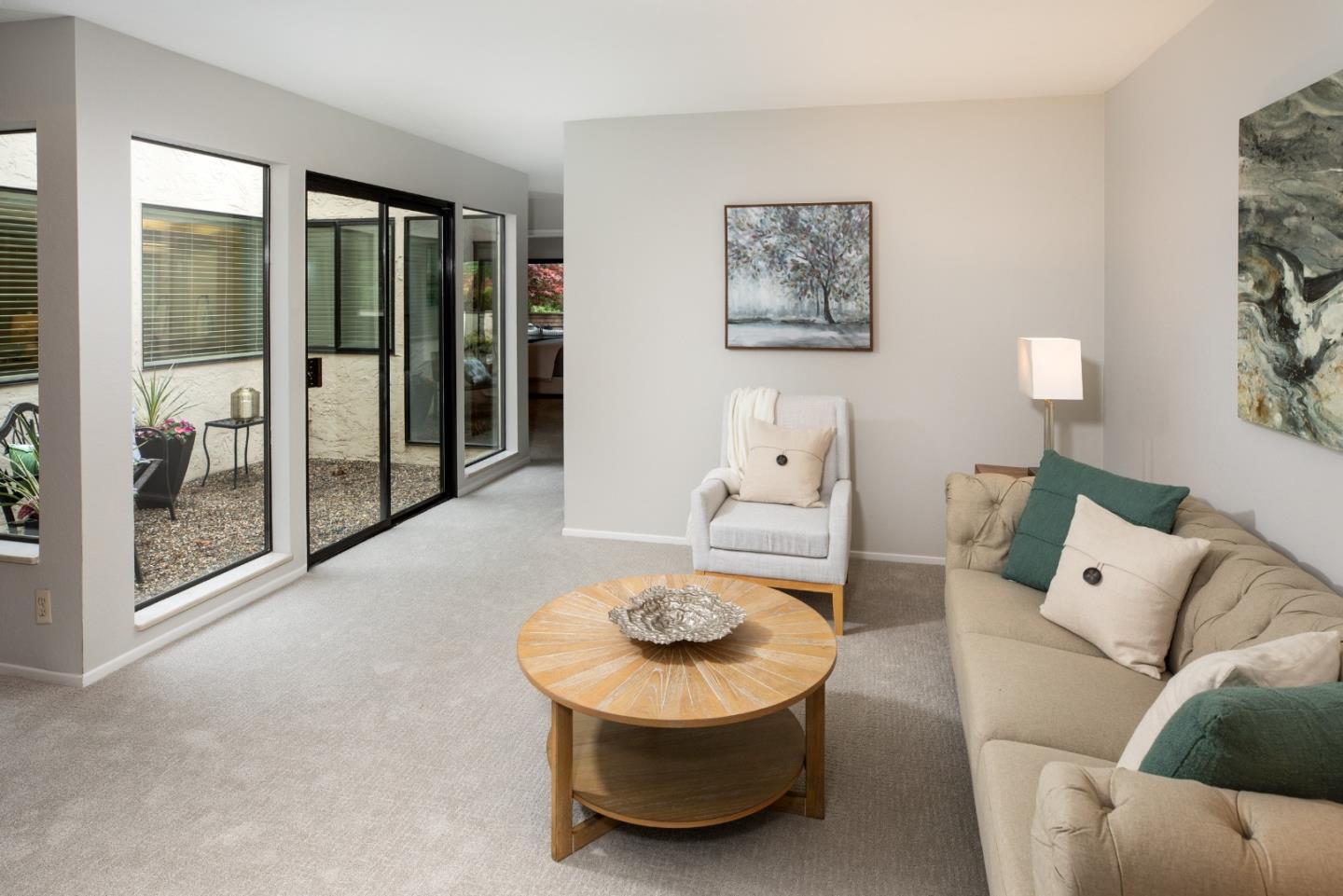 22415 Rancho Deep Cliff Drive Cupertino, CA 95014 - Photo 13 of 33 a living room with furniture and a large window