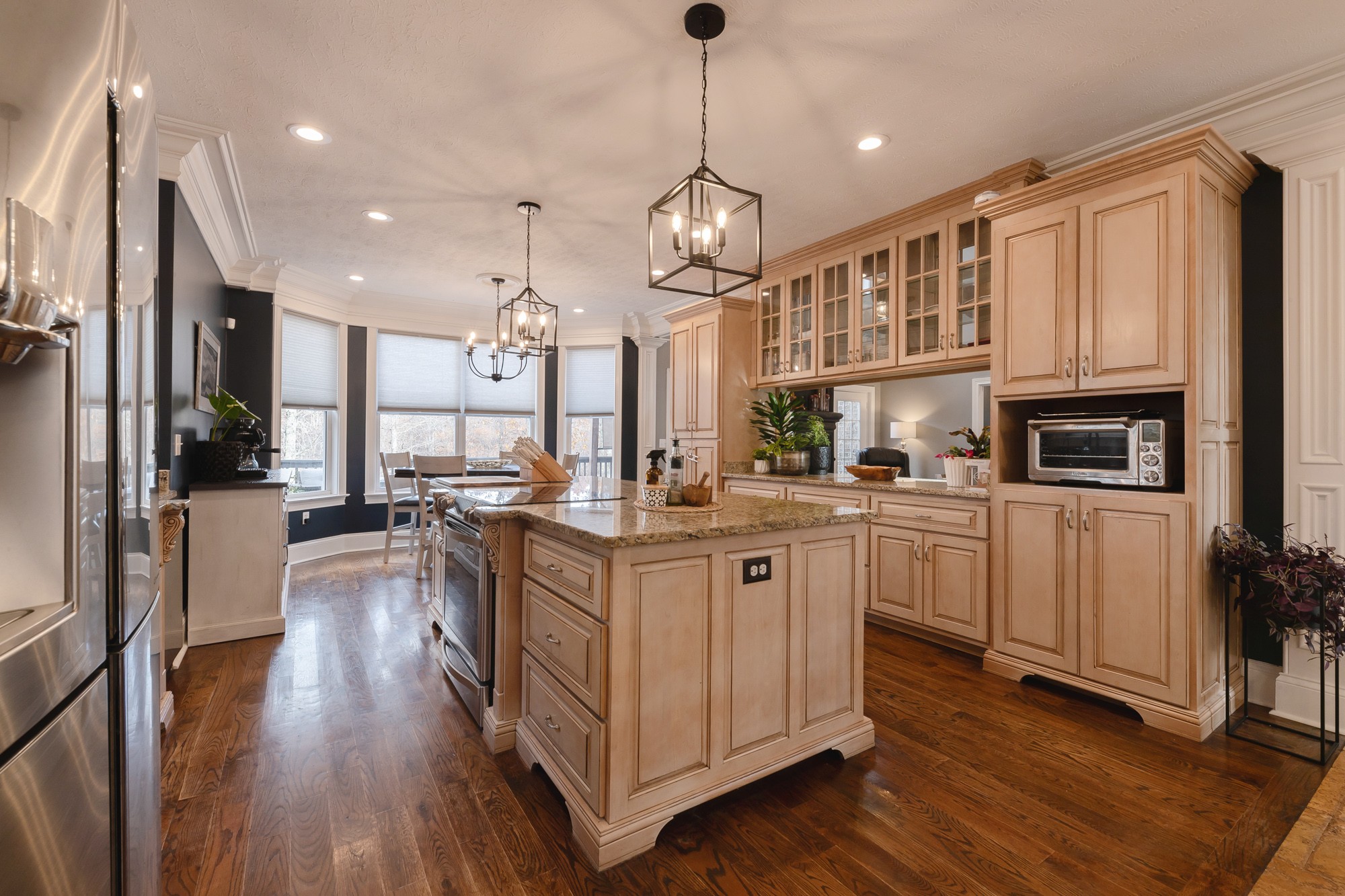 5061 Spears Road Centerville, TN 37033 - Photo 30 of 55 a kitchen with stainless steel appliances granite countertop a refrigerator a sink dishwasher a oven and a dining table with wooden floor