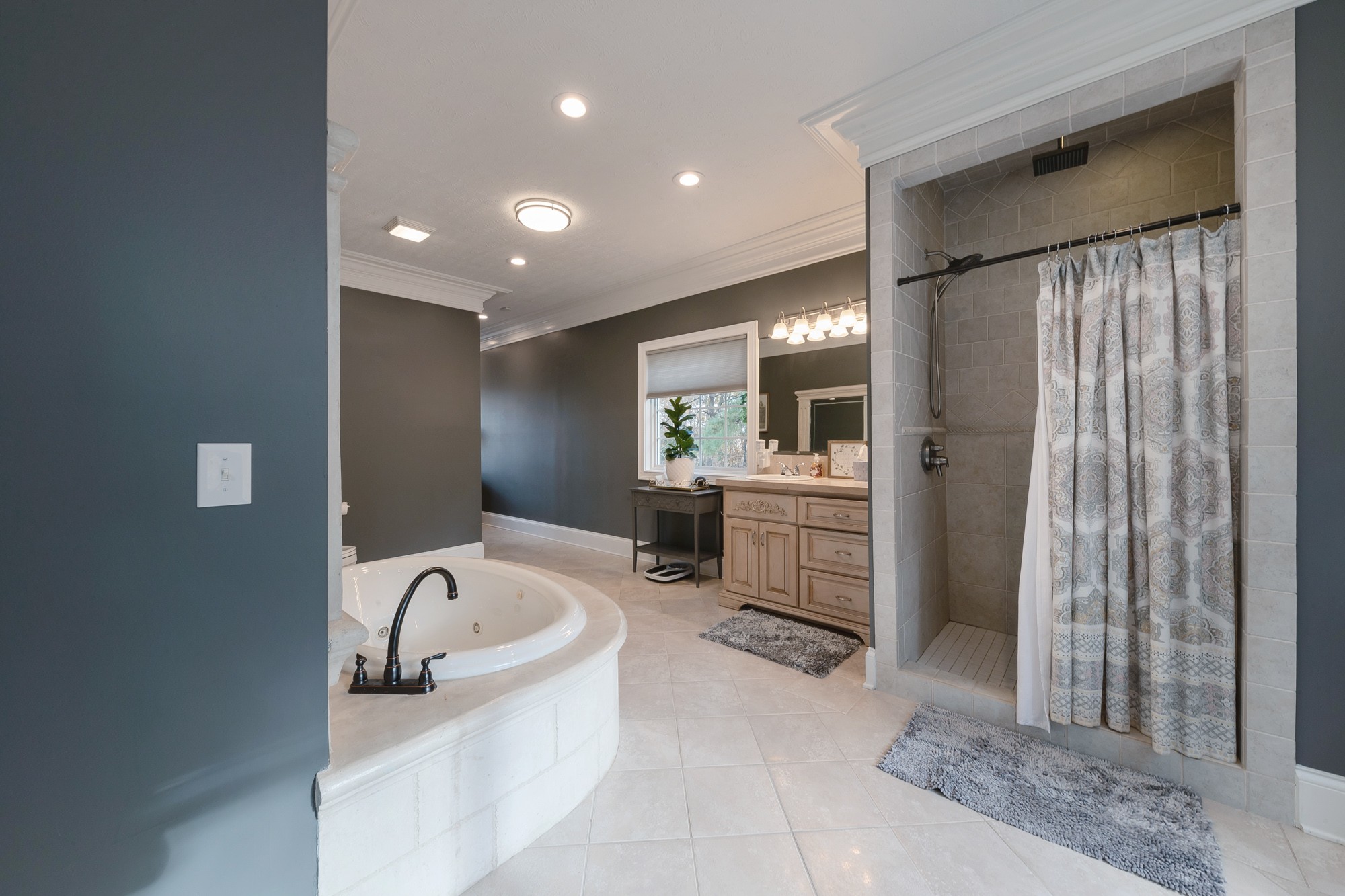 5061 Spears Road Centerville, TN 37033 - Photo 45 of 55 a bathroom with a tub sink and mirror