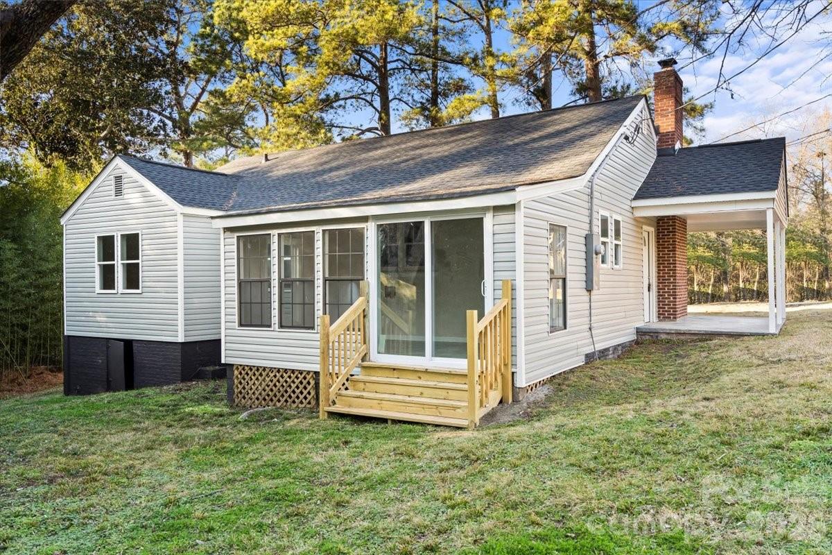 165 East Lacy Street Chester, SC 29706 - Photo 15 of 16 a front view of a house with a garden