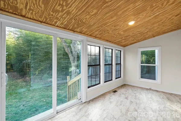 a view of an empty room with a balcony