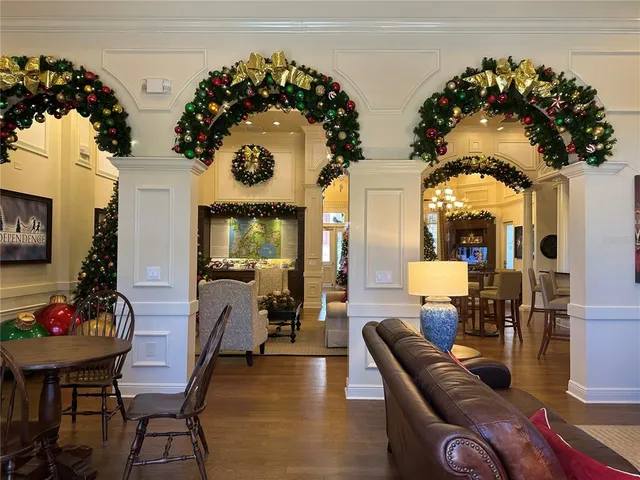 a view of a dining room with furniture and chandelier