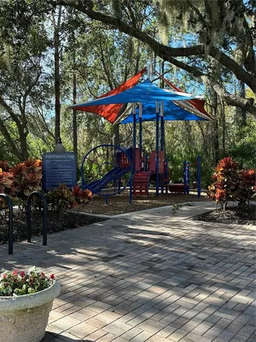 a view of a table and chairs in the patio in front of a house