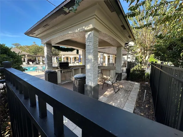 a view of a living room and outdoor kitchen
