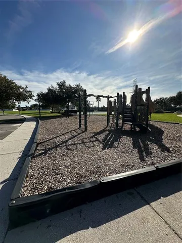 a view of a park with swings