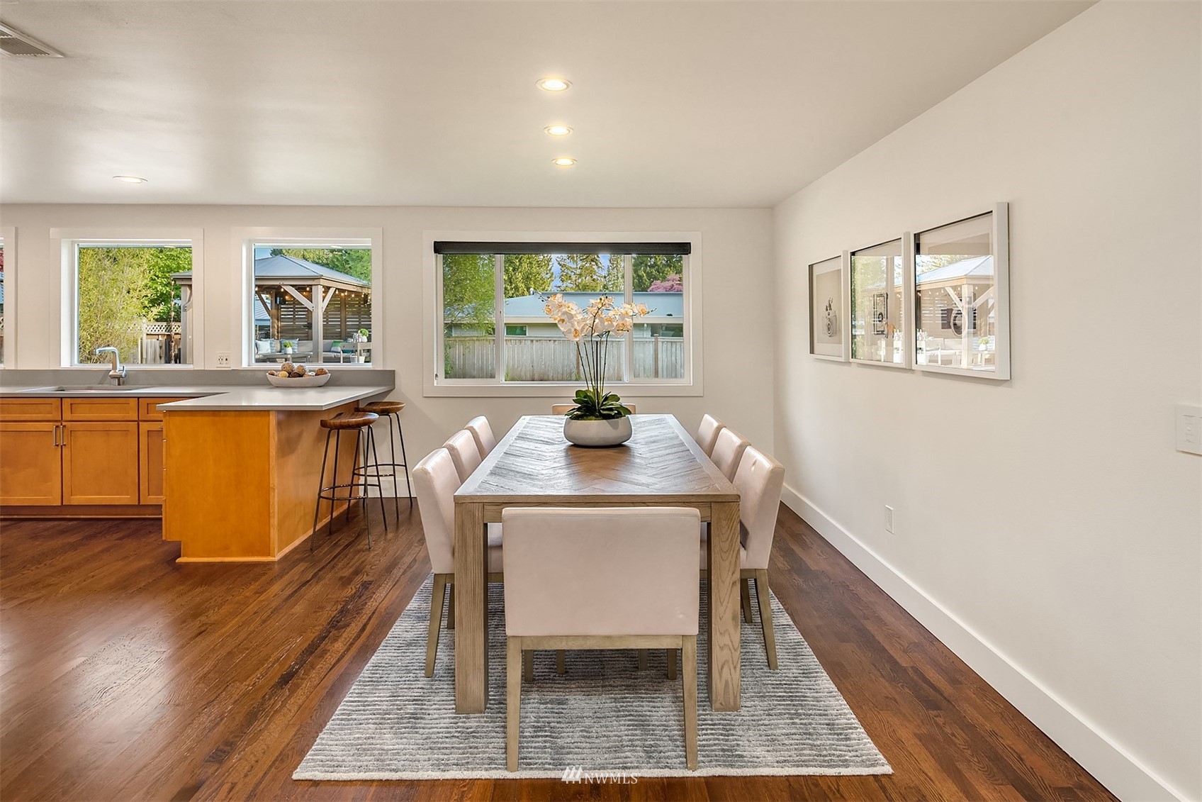 14217 Southeast 144th Street Renton, WA 98059 - Photo 11 of 30 a view of a dining room with furniture window and wooden floor