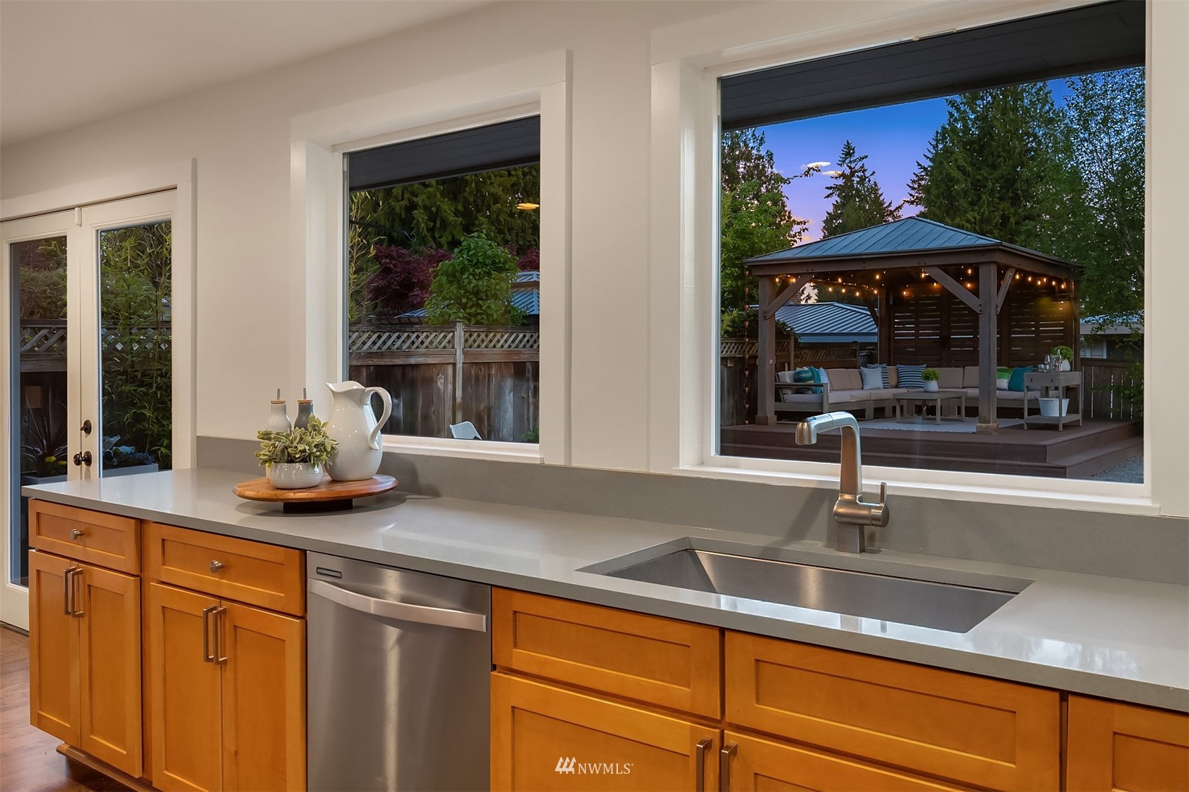 14217 Southeast 144th Street Renton, WA 98059 - Photo 13 of 30 a kitchen sink with granite countertop a view of living room