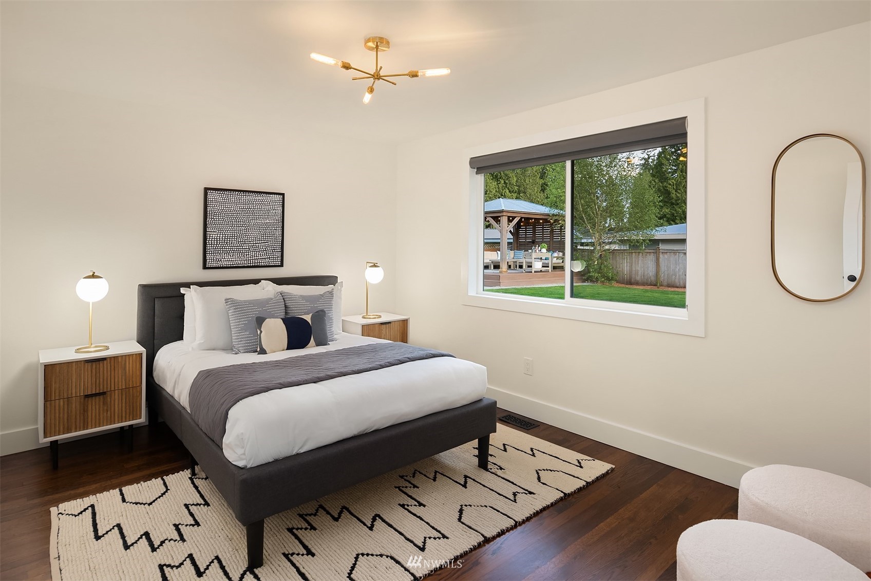 14217 Southeast 144th Street Renton, WA 98059 - Photo 14 of 30 a bedroom with a bed wooden floor and window