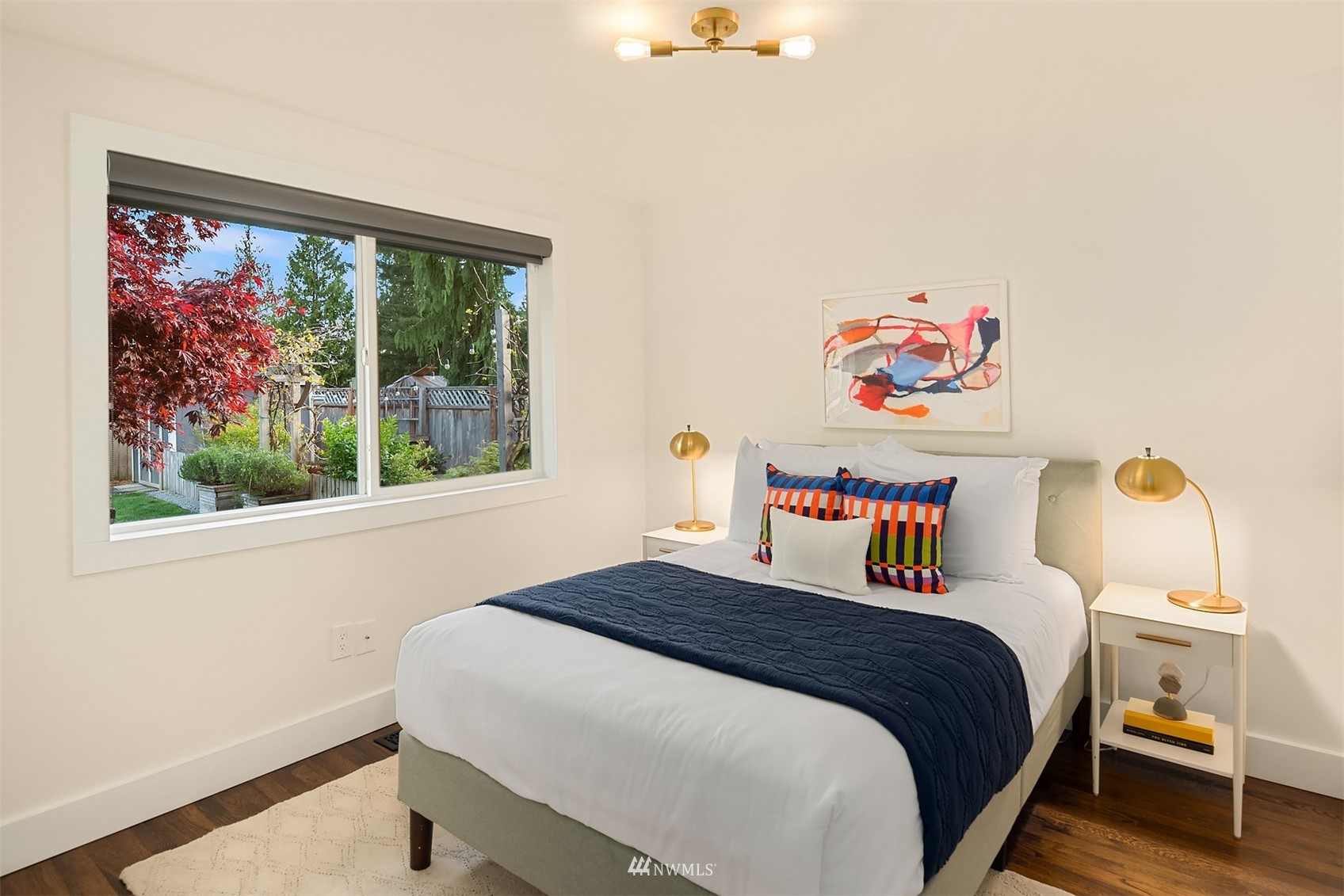 14217 Southeast 144th Street Renton, WA 98059 - Photo 15 of 30 a bedroom with a bed and a window