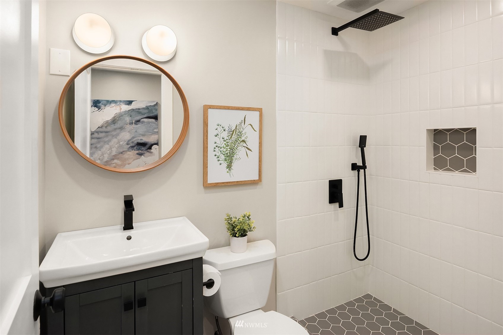 14217 Southeast 144th Street Renton, WA 98059 - Photo 18 of 30 a bathroom with a sink a toilet and a mirror