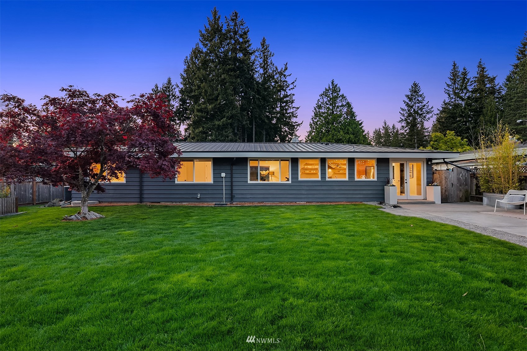 14217 Southeast 144th Street Renton, WA 98059 - Photo 23 of 30 a view of a yard with a house in the background