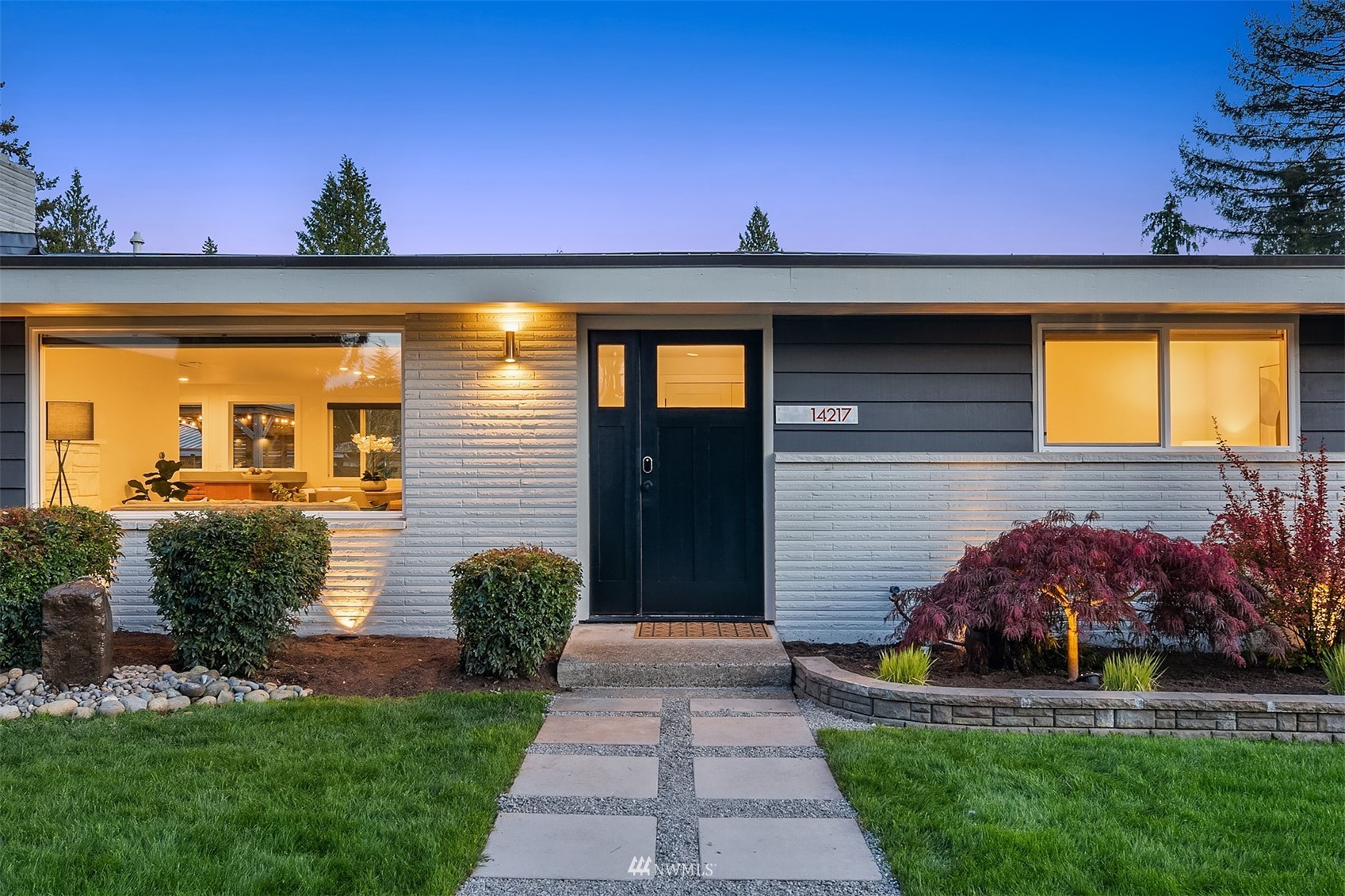 14217 Southeast 144th Street Renton, WA 98059 - Photo 27 of 30 a front view of a house with a garden