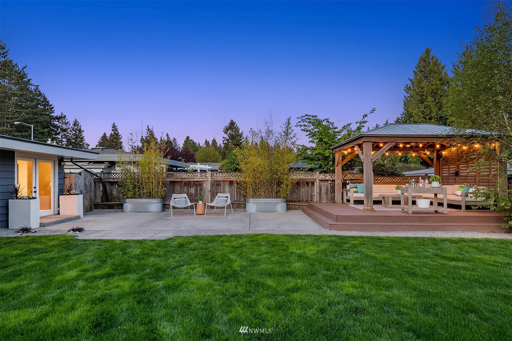 14217 Southeast 144th Street Renton, WA 98059 - Photo 3 of 30 a patio area with chairs and a table