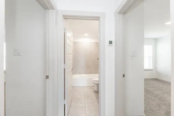 a bathroom with a glass shower door