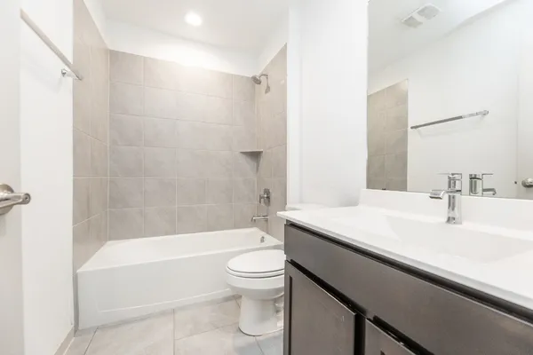 a bathroom with a sink a toilet and a bathtub