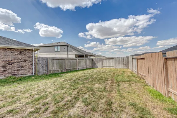 a view of a backyard of the house