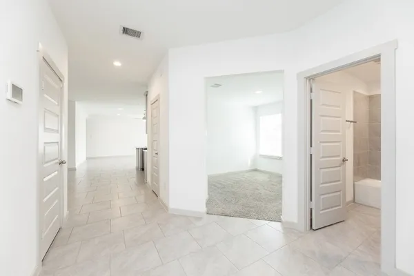 wooden floor with a bathroom and a sink