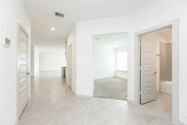 wooden floor with a bathroom and a sink