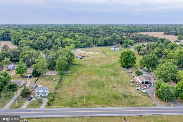 a view of a big yard with houses