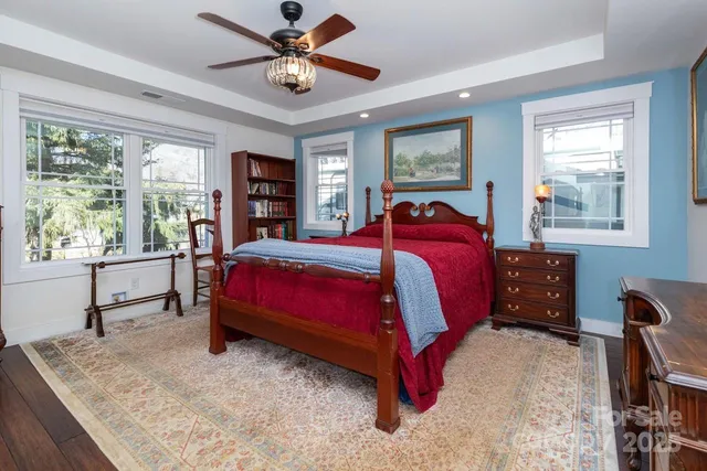 a bedroom with a large bed and a window