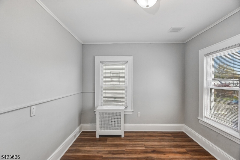 1017 Grandview Avenue Union, NJ 07083 - Photo 17 of 34 a view of an empty room with a window and wooden floor