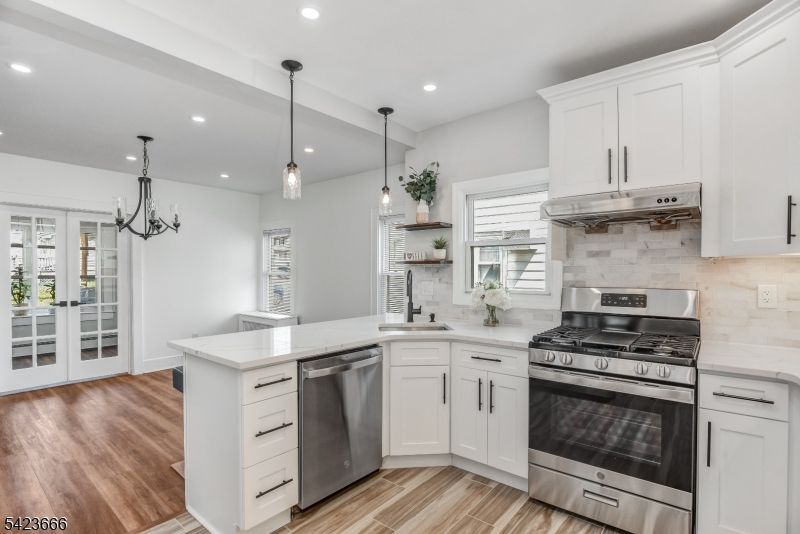 1017 Grandview Avenue Union, NJ 07083 - Photo 20 of 34 a kitchen with stainless steel appliances granite countertop a stove a sink and a refrigerator
