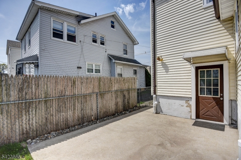 1017 Grandview Avenue Union, NJ 07083 - Photo 28 of 34 a view of backyard with small cabin and wooden fencing
