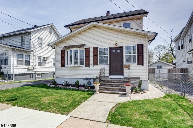 1017 Grandview Avenue Union, NJ 07083 - Photo 4 of 34 a front view of a house with a yard