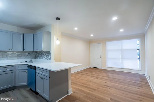 a room with a sink vanity and a mirror
