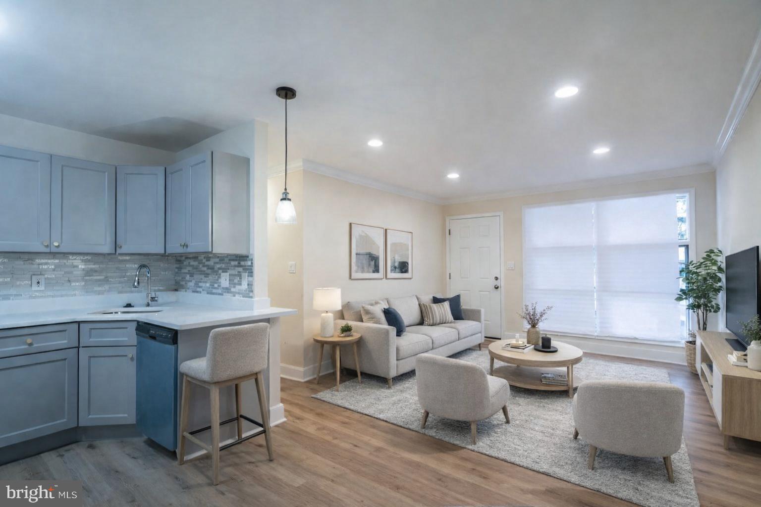 7313 Dooman Road Baltimore, MD 21244 - Photo 12 of 35 a living room with furniture and a potted plant