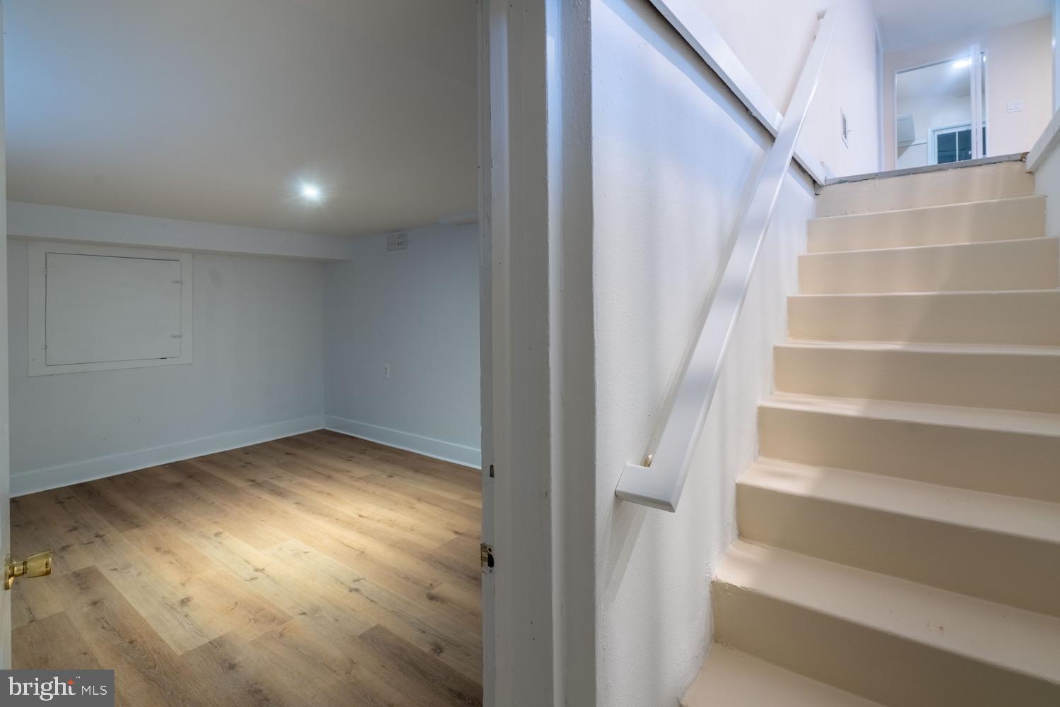 7313 Dooman Road Baltimore, MD 21244 - Photo 18 of 35 a view of an empty room with stairs