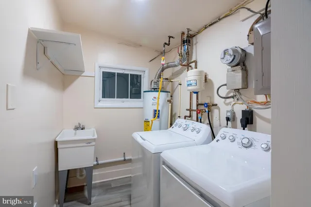 a bathroom with a sink vanity and a mirror