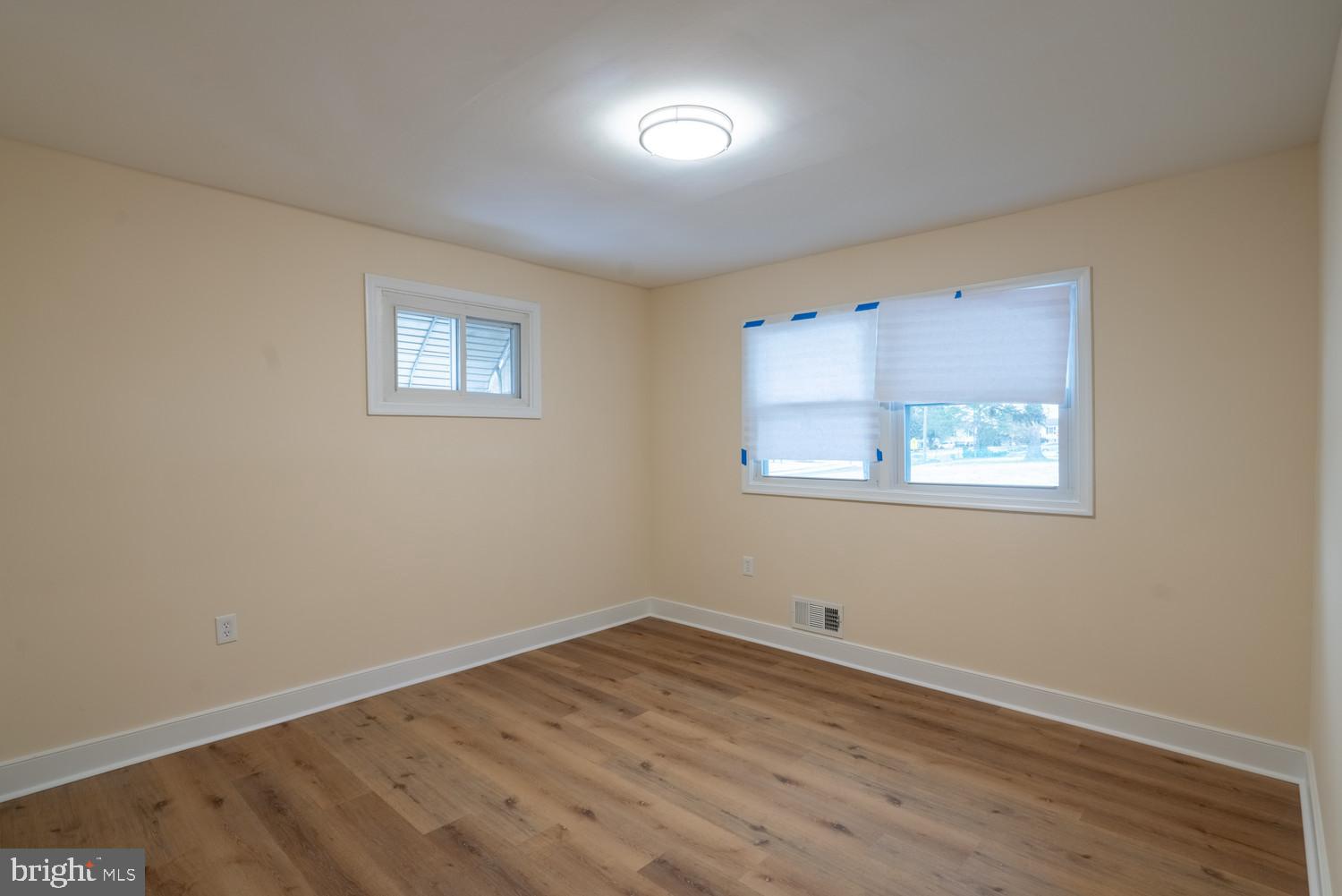 7313 Dooman Road Baltimore, MD 21244 - Photo 23 of 35 a view of a room with wooden floor and windows