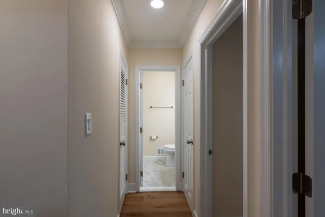 a view of a bathroom from a hallway