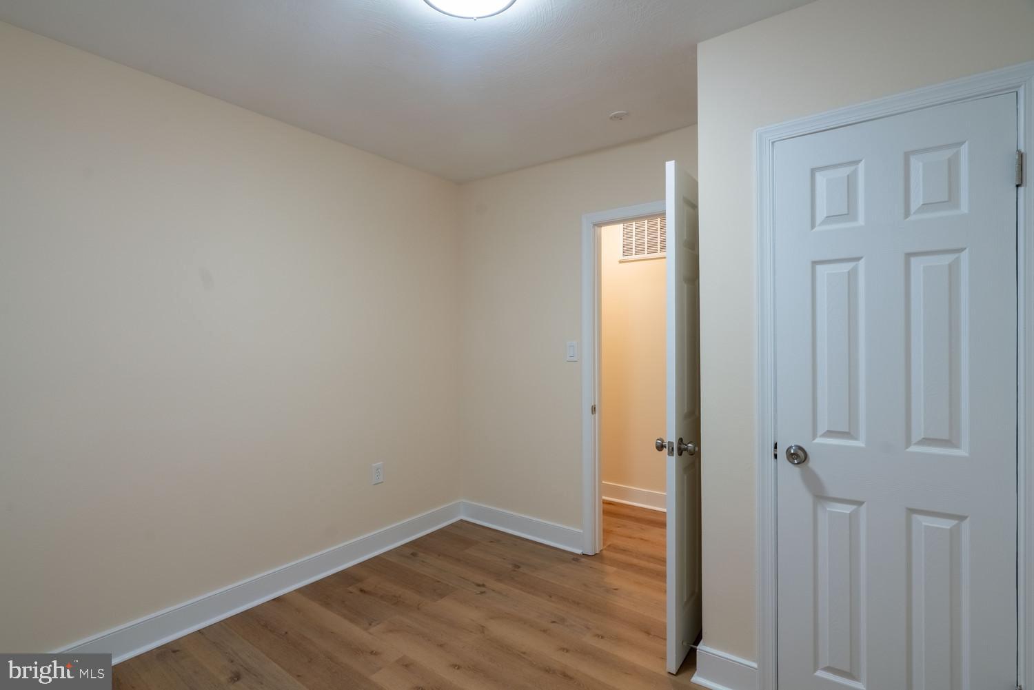 7313 Dooman Road Baltimore, MD 21244 - Photo 33 of 35 wooden floor in an empty room