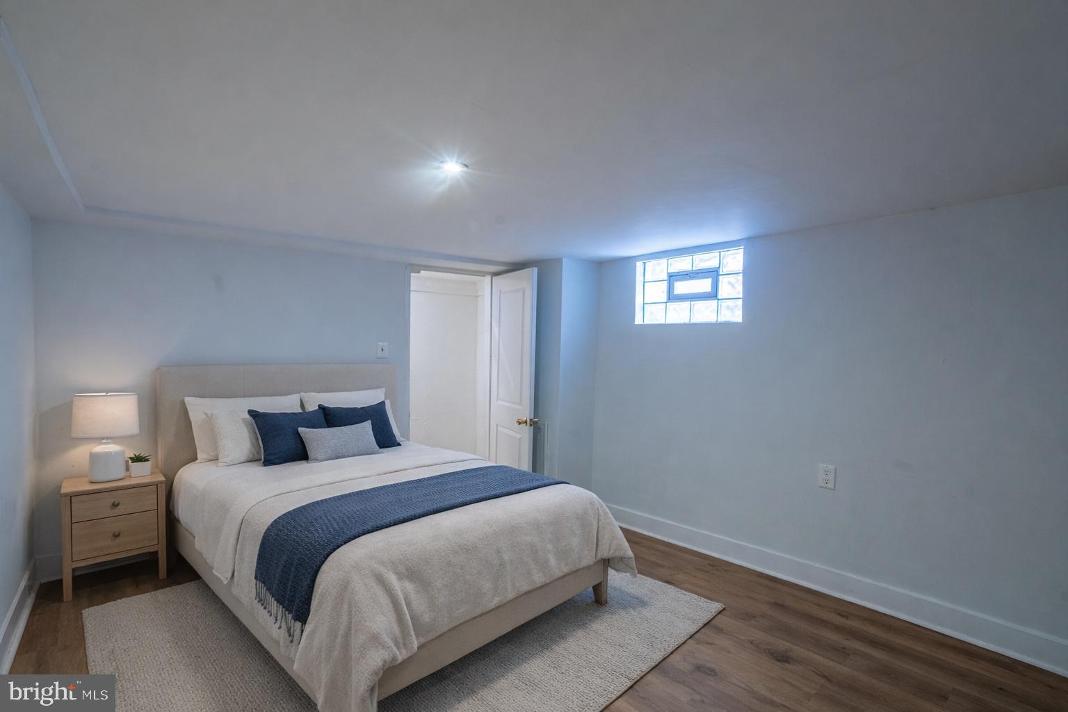 7313 Dooman Road Baltimore, MD 21244 - Photo 35 of 35 a bedroom with a bed and a night stand