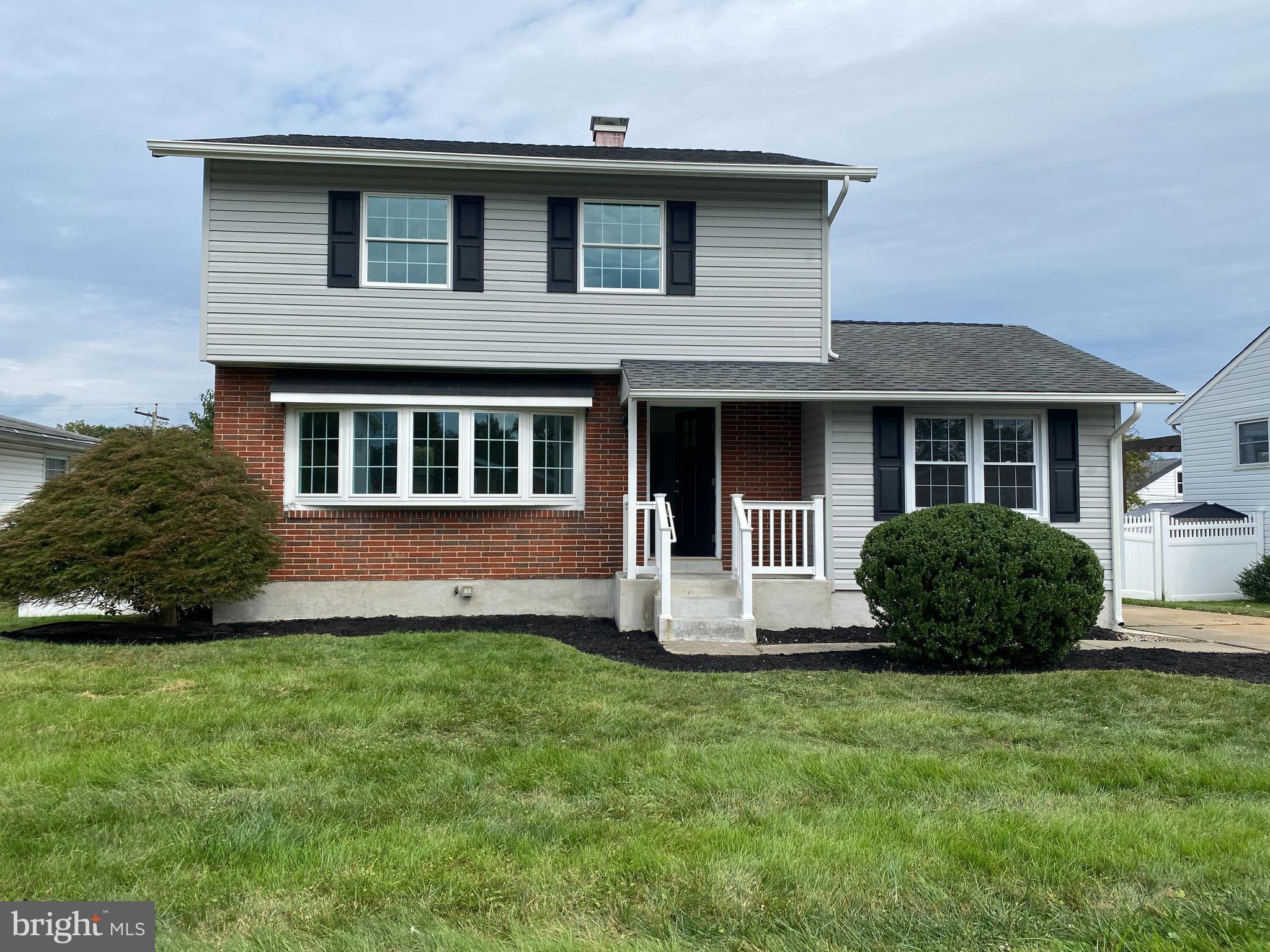 8921 Parlo Road Nottingham, MD 21236 - Photo 1 of 40 a front view of a house with a yard